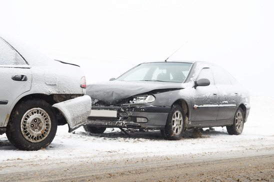 car crash accident at snow road in winter